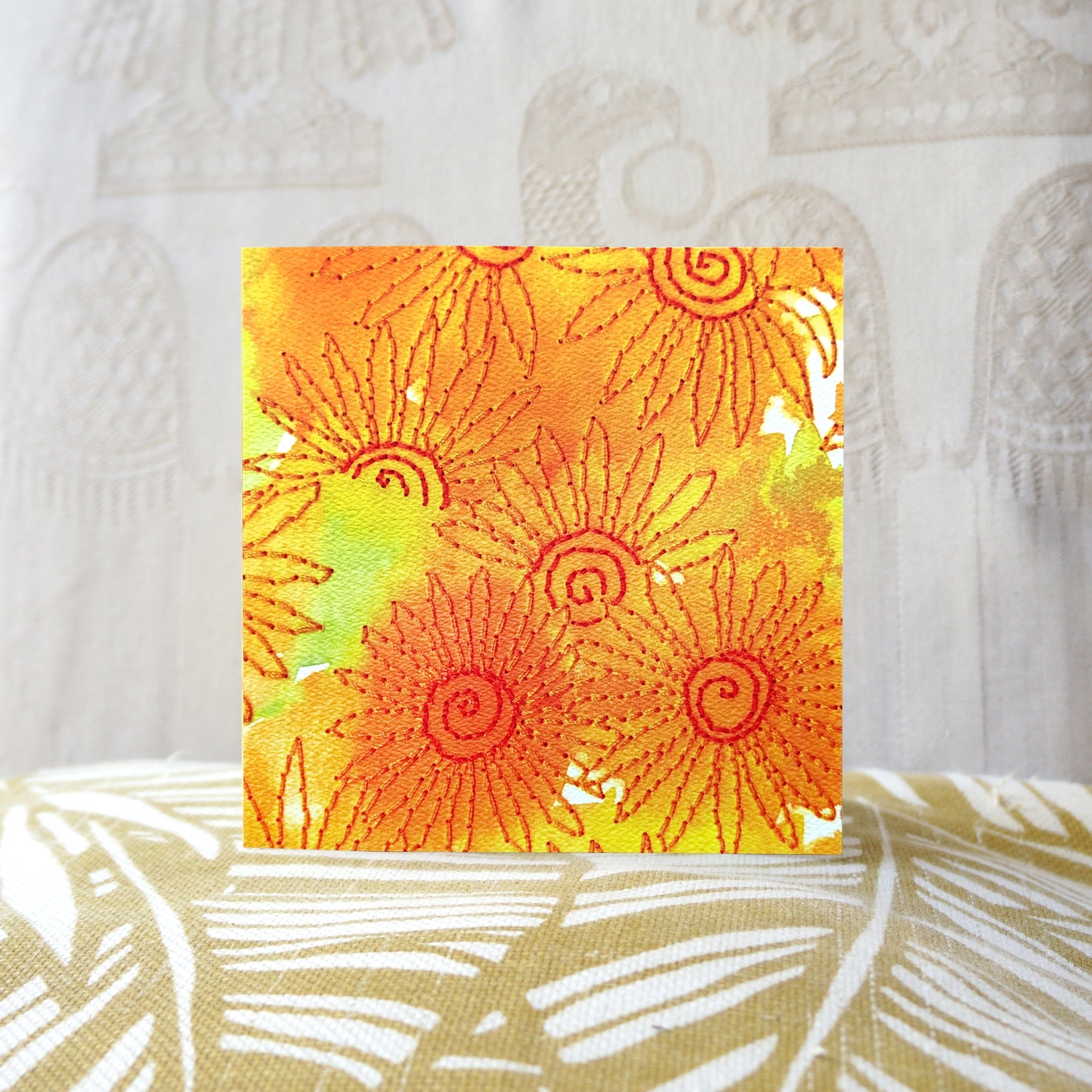 If Smiles Were Sunflowers, sunshine greetings card. Featuring a sunny orange, floral, nature themed, embroidery illustration. Perfect for stationery lovers, nature lovers, embroiders, art lovers, to say thank you, birthdays or just because. 14cm x 14cm, square in size and printed on premium quality 300gsm card stock. Designed by luxury gifts and stationery brand, Bella & The Moon.