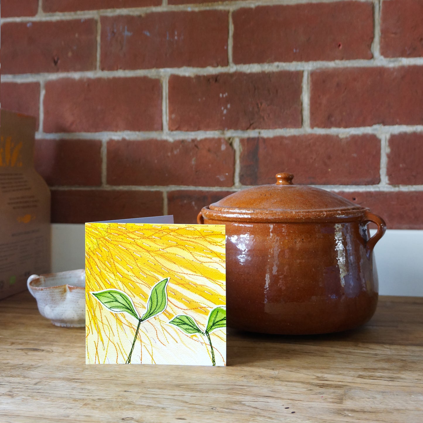 If Smiles Were Sunflowers, sunshine greetings card. Featuring a sunny yellow, floral, nature themed, embroidery illustration. Perfect for stationery lovers, nature lovers, embroiders, art lovers, to say thank you, birthdays or just because. 14cm x 14cm, square in size and printed on premium quality 300gsm card stock. Designed by luxury gifts and stationery brand, Bella & The Moon.