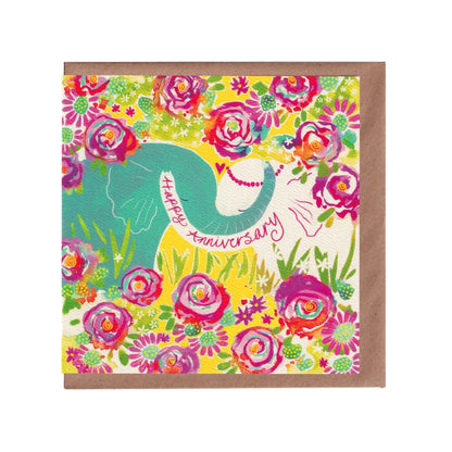 Colourful anniversary card with two elephants in an embrace amongst and jungle of flowers, featuring 'Happy Anniversary' text on the elephants trunk. 14cm x 14cm in size and printed on premium quality 300gsm card. Designed by luxury gifts and stationery brand, Bella & The Moon.