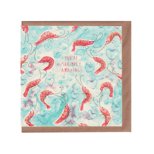 Love or valentine's day card with an underwater shrimp pattern and 'You're Simply Amazing' text on a light blue background with heart-shaped bubbles. 14cm x 14cm square in size and printed on premium quality 300gsm card stock. Designed by luxury handmade gifts and stationery brand Bella & The Moon