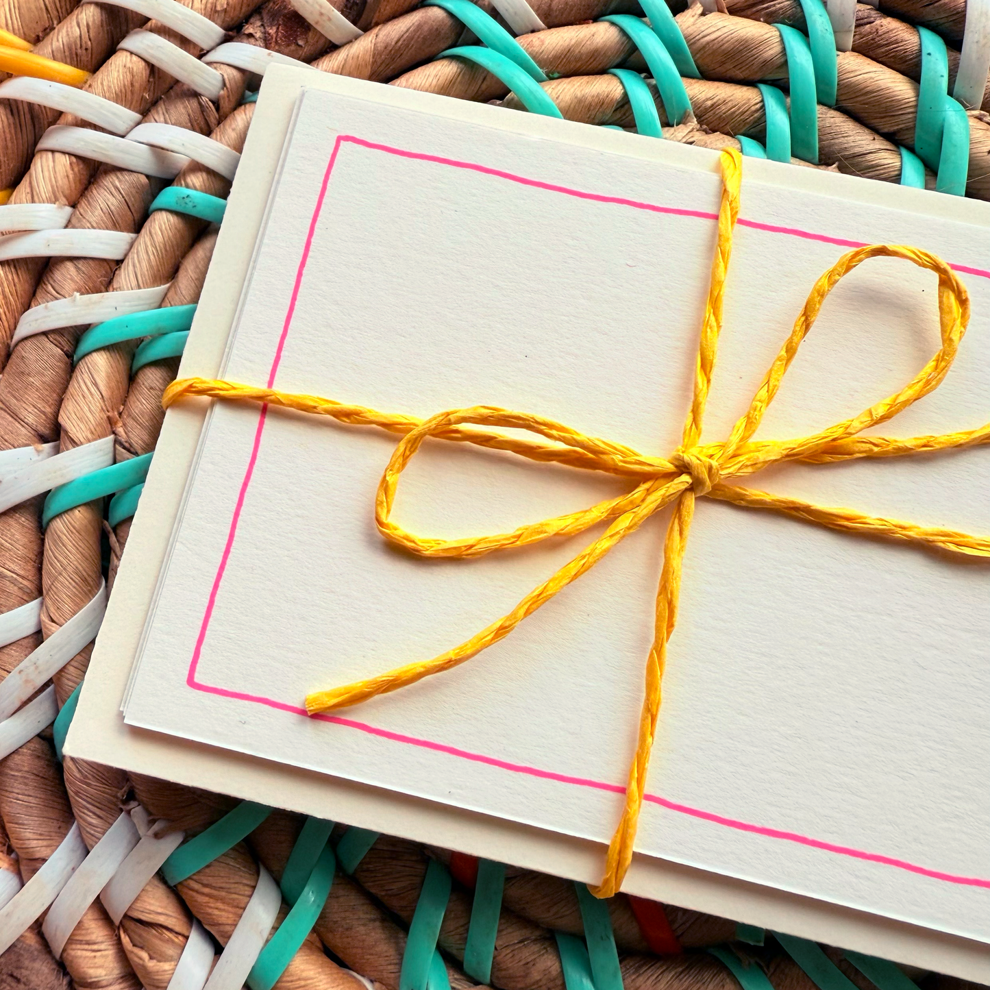Pink border, hand detailed notecards tied with yellow string. Sets of 6 notecards and envelopes with hand detailed designs on each card. Gifts for birthdays or to send to friends. A7 in size. Bella & The Moon gifts and stationery