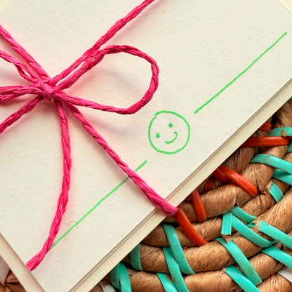 Green smiley face, hand detailed notecards tied with pink string. Sets of 6 notecards and envelopes with hand detailed designs on each card. Gifts for birthdays or to send to friends. A7 in size. Bella & The Moon gifts and stationery