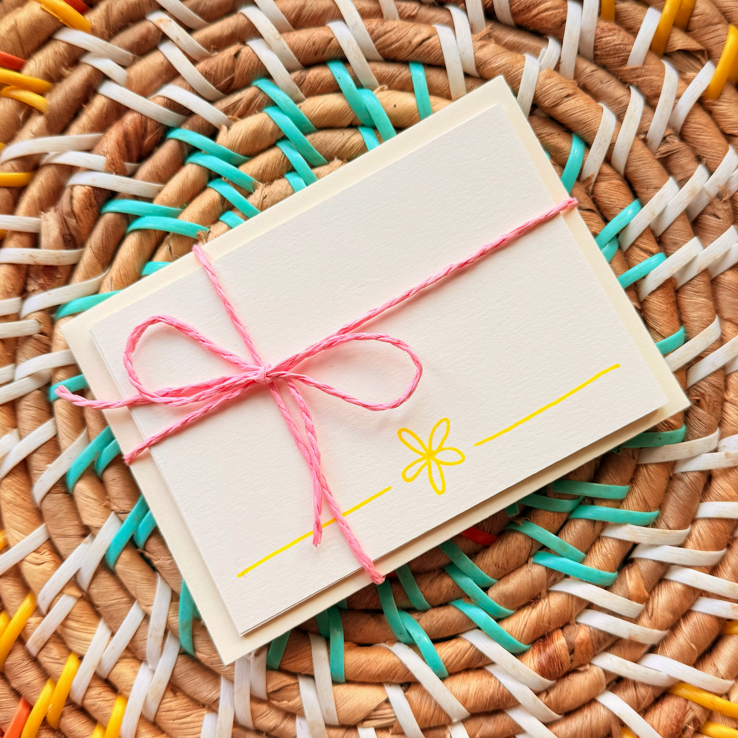 Yellow daisy, hand detailed notecards tied with pink string. Sets of 6 notecards and envelopes with hand detailed designs on each card. Gifts for birthdays or to send to friends. A7 in size. Bella & The Moon gifts and stationery