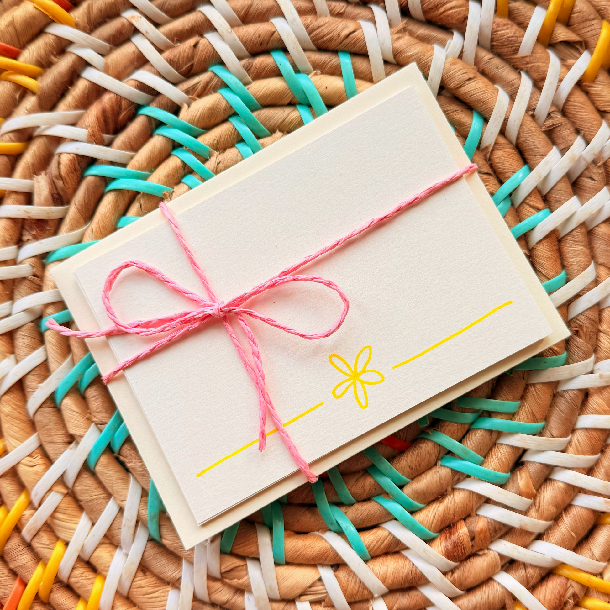 Yellow daisy, hand detailed notecards tied with pink string. Sets of 6 notecards and envelopes with hand detailed designs on each card. Gifts for birthdays or to send to friends. A7 in size. Bella & The Moon gifts and stationery