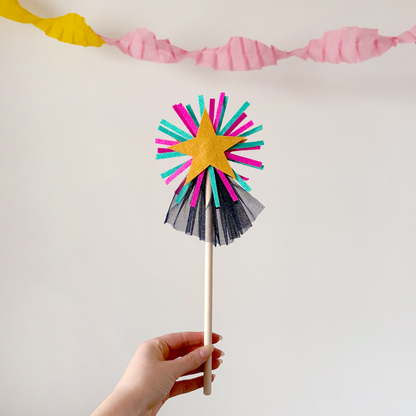 A handmade felt fairy wand featuring a gold star, pink details and blue sparkly netting. Great gifts for kids, dressing-up boxes, fancy dress and party bags. Bella & The Moon gifts and stationery.