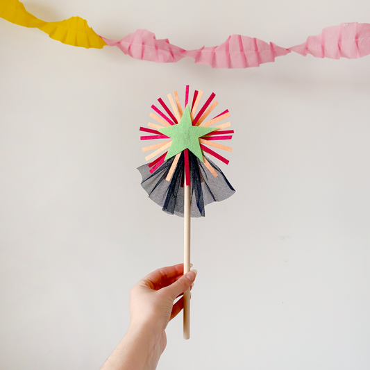 A handmade felt fairy wand featuring a green star, pink details and blue sparkly netting. Great gifts for kids, dressing-up boxes, fancy dress and party bags. Bella & The Moon gifts and stationery.