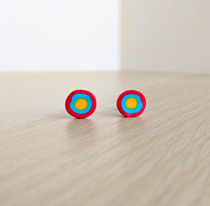 Handmade gobstopper stud earrings made from red, blue and yellow clay. Handmade by luxury gifts and stationery brand, Bella & The Moon