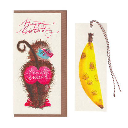 A funny baboon happy birthday greetings card with the words 'sweet cheeks'. It features a big-bottomed baboon on an extra special greeting card. The card includes a cut-out bookmark inside with a banana illustration. DL in size. Bella & The Moon gifts and stationery 