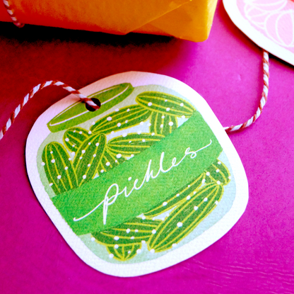 A photo of cut-out, jars-of-pickles gift tag of string. Present and gift wrapping. Unique and funny gifting ideas for pickle addicts. Bella & The Moon gift and stationery