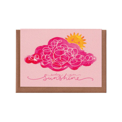 A pink greeting card featuring a pink cloud and yellow sunshine with the words 'sending you sunshine'. A positive, encouraging and heartwarming card. A6 in size. Bella & The Moon gifts and stationery.