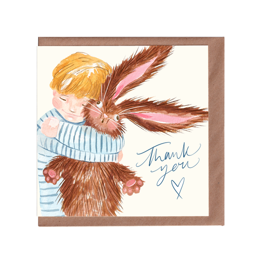 Thank You greetings card inspired by cuteness aggression, featuring a comical, heart warming, blonde child hugging a fluffy rabbit. Perfect for saying thank you. 14cm x 14cm, square in size and printed on premium quality 300gsm card stock. Designed by luxury gift and stationery brand, Bella & The Moon.